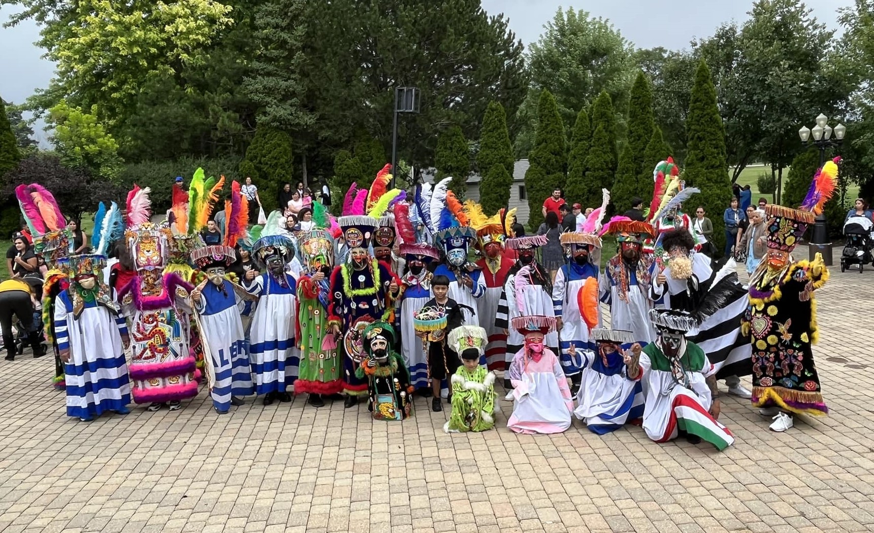 A group of Chinelo dancers gathered together.